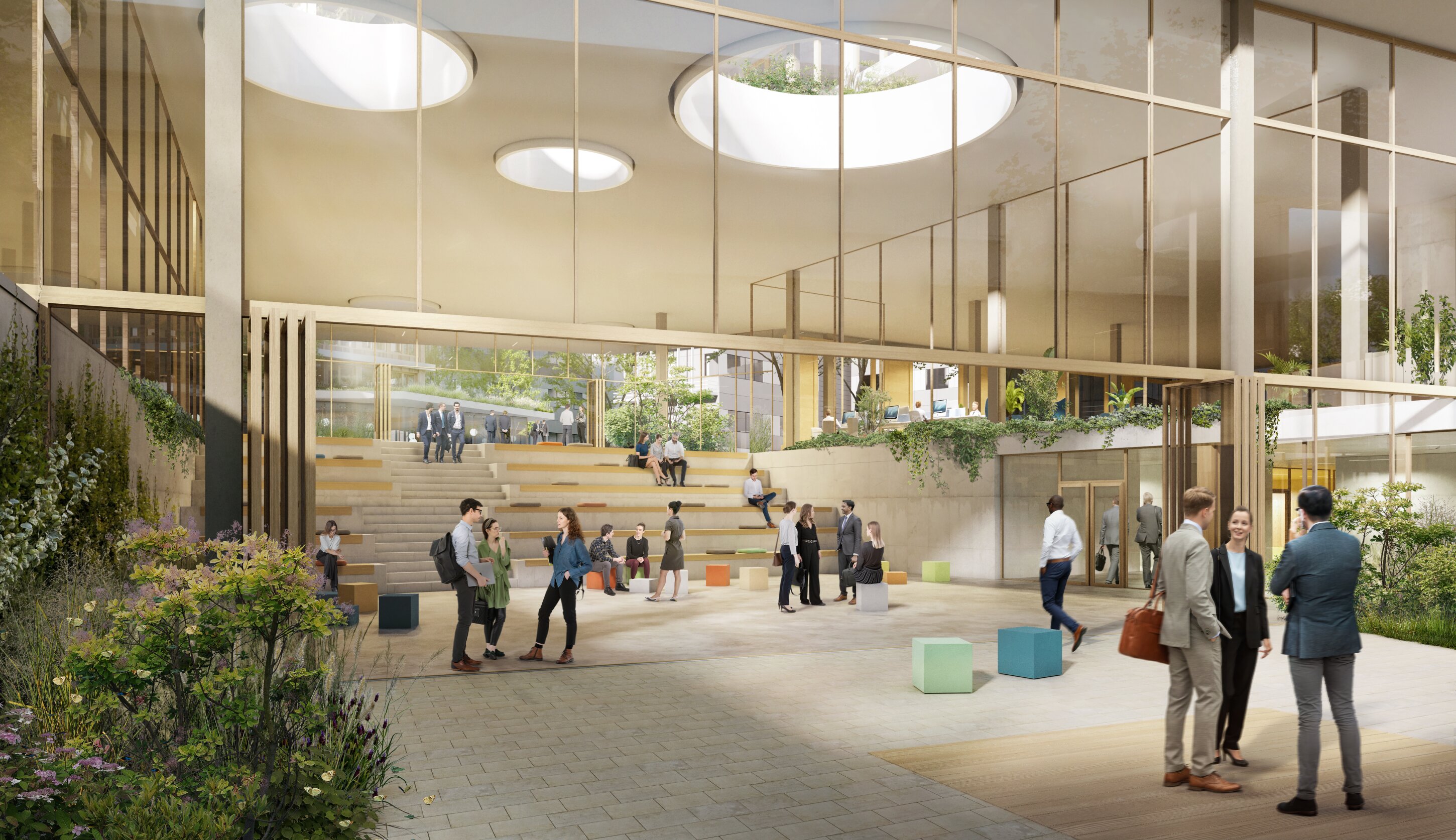 Project by Behnisch Architekturbuero, Campus Giesing. Spacious indoor atrium with tiered seating, skylights, plants, and people sitting, walking, and talking in a bright office courtyard.